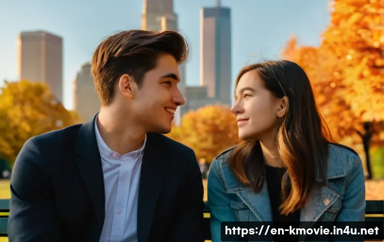 건축학개론 명대사와 음악 - A close-up scene of two young adults having a heartfelt conversation on a city park bench during gol...